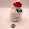 White Sitting Puffball Cat with Santa Hat - Image 3