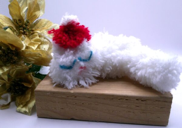 Sleeping White Puffball Cat in a Santa Hat